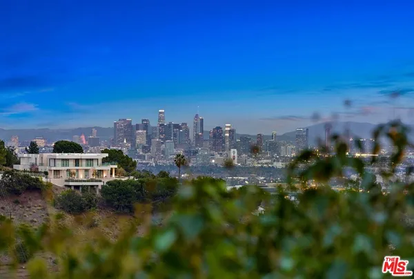 a view of a city with tall buildings