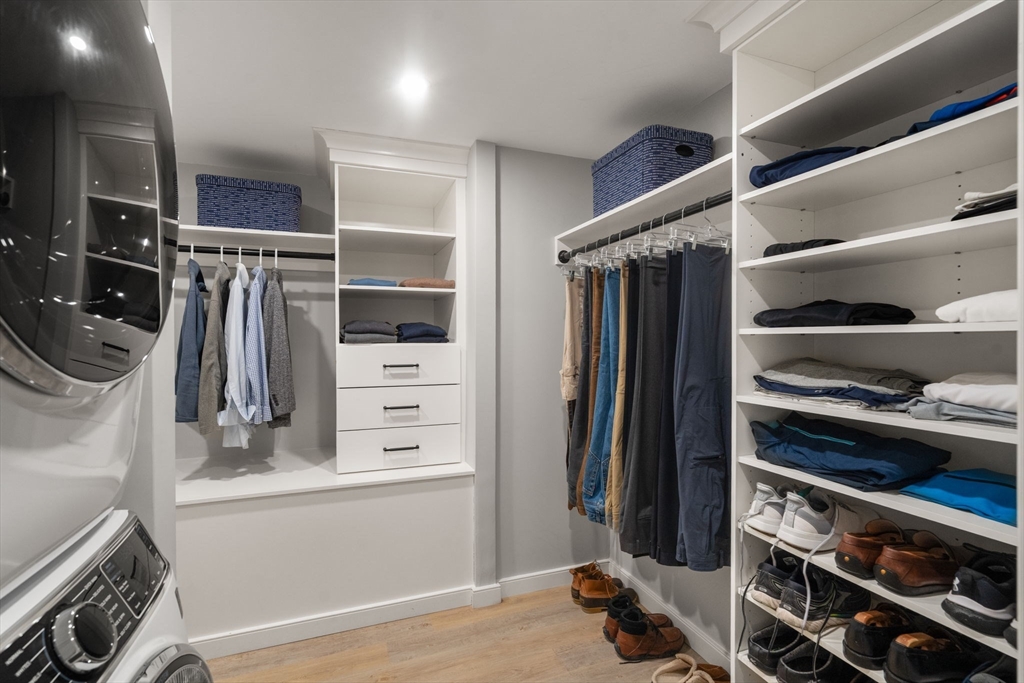 65 Grove Wellesley Ma, Unit 152 Wellesley, MA 02482 - Photo 10 of 16 a view of walk in closet with clothes and shoes