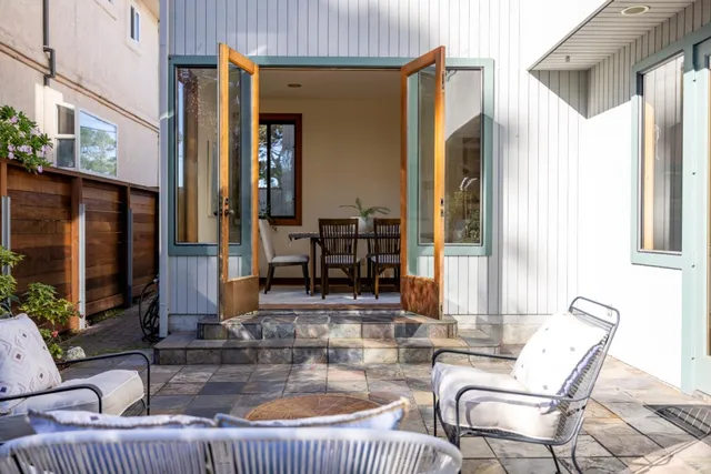 a kitchen view with table and chairs