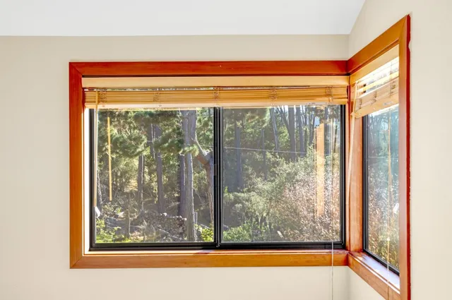 a view of a bathtub in a room next to a window