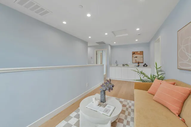 a living room with furniture and a table