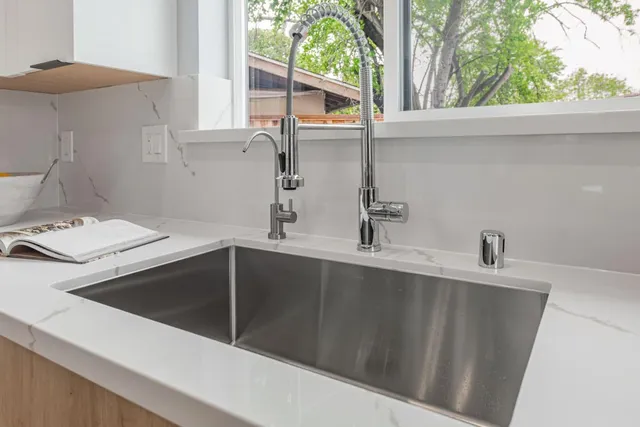 a kitchen with a sink and a window