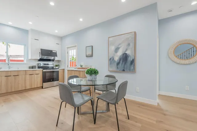 a kitchen with a table and chairs in it