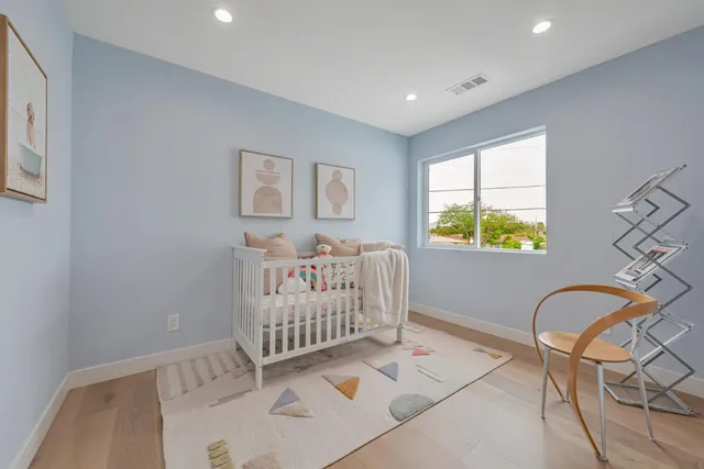 a bedroom with furniture and a window