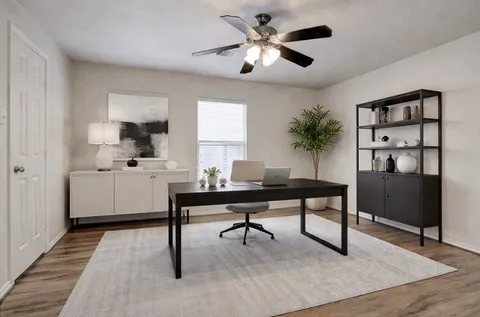 a kitchen with a sink appliances and cabinets