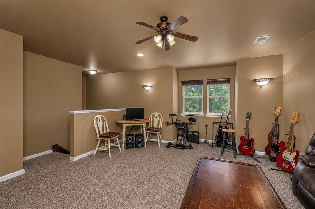 100 Manders Court Runaway Bay, TX 76426 - Photo 22 of 33 a living room with furniture and a large window