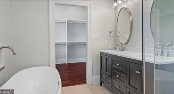 a bedroom with bed and window