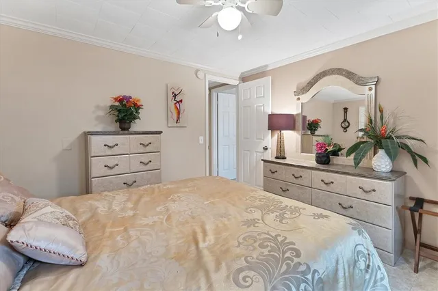 a bedroom with a bed and a dresser