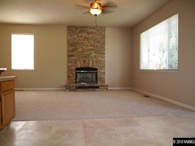 3938 Aspendale Drive Reno, NV 89503 - Photo 4 of 9 a view of an empty room with a fireplace
