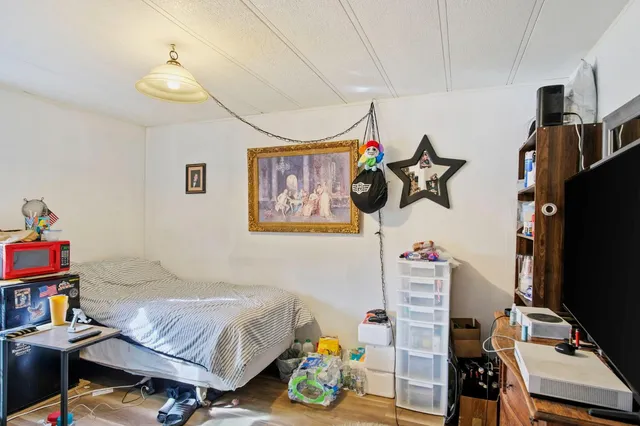 a kitchen with granite countertop a sink stove and microwave