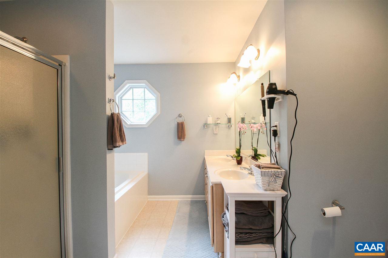 11 Ashton Road Palmyra, VA 22963 - Photo 13 of 30 a bathroom with a sink a mirror and a shower