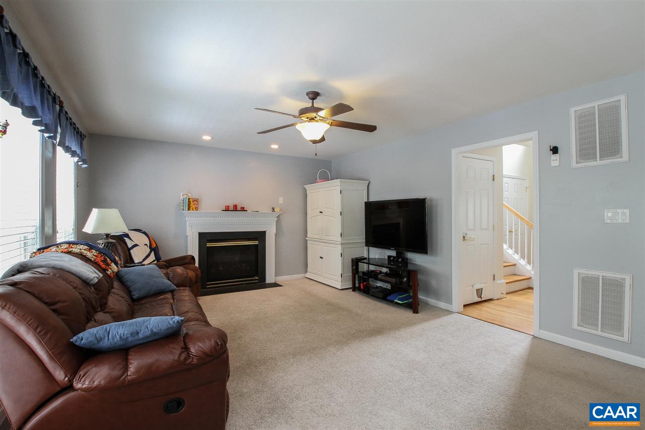 11 Ashton Road Palmyra, VA 22963 - Photo 4 of 30 a living room with furniture a fireplace and a flat screen tv