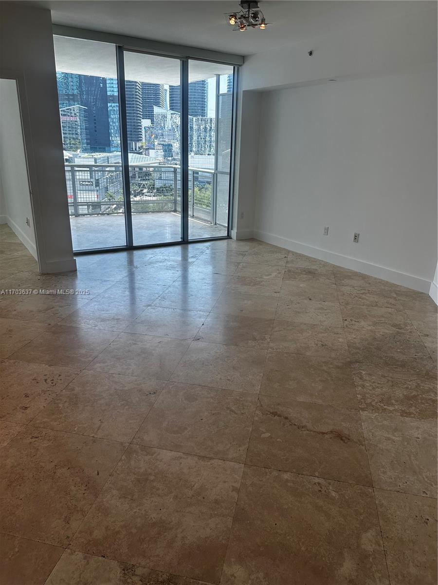 350 South Miami Avenue, Unit 1704 Miami, FL 33130 - Photo 12 of 13 a view of an empty room with windows