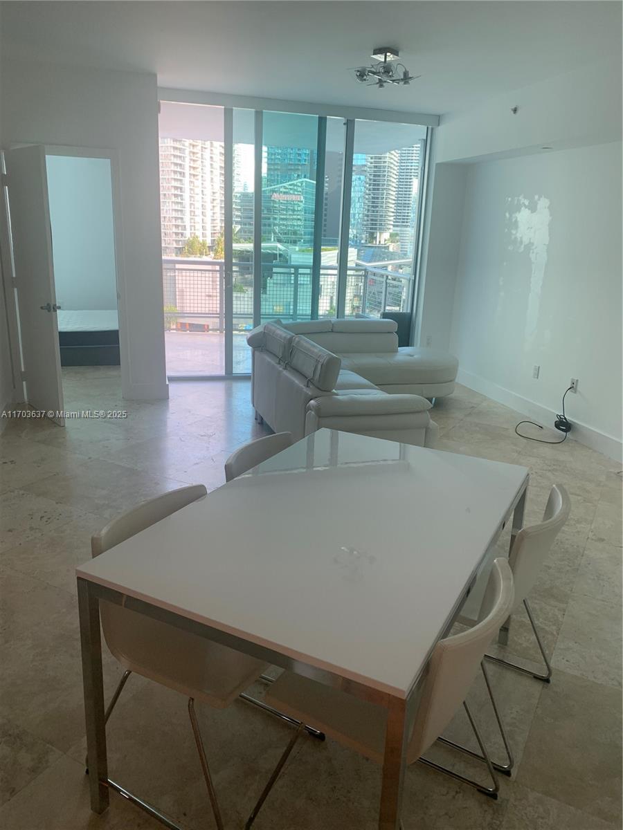 350 South Miami Avenue, Unit 1704 Miami, FL 33130 - Photo 2 of 13 a view of a room with furniture and window