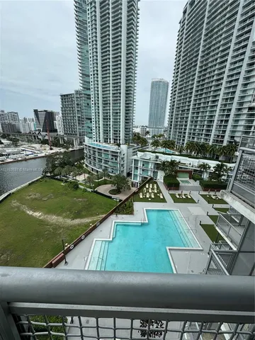 a view of a swimming pool with chairs