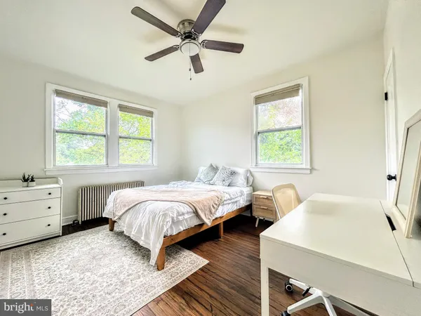 a bed room with a bed and a window