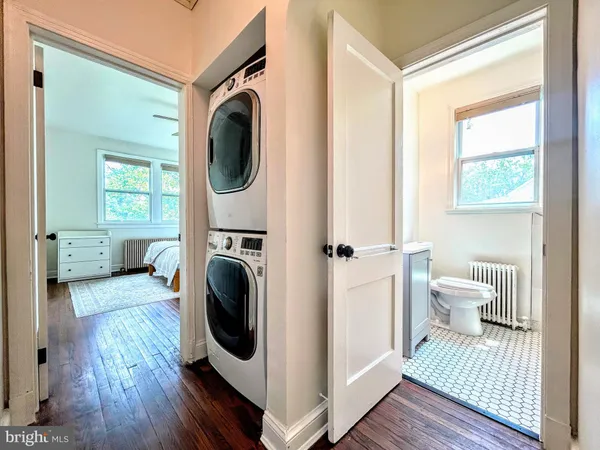 a bathroom with a toilet and a window