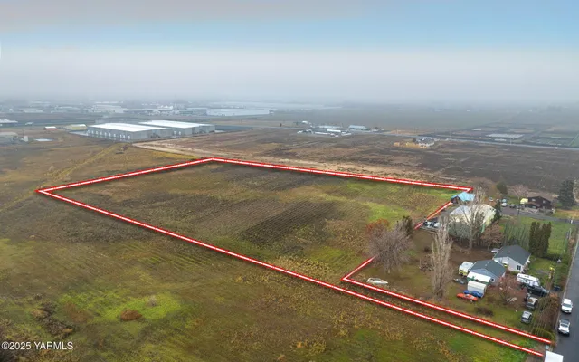 a view of a room with floor to ceiling window and mountain view
