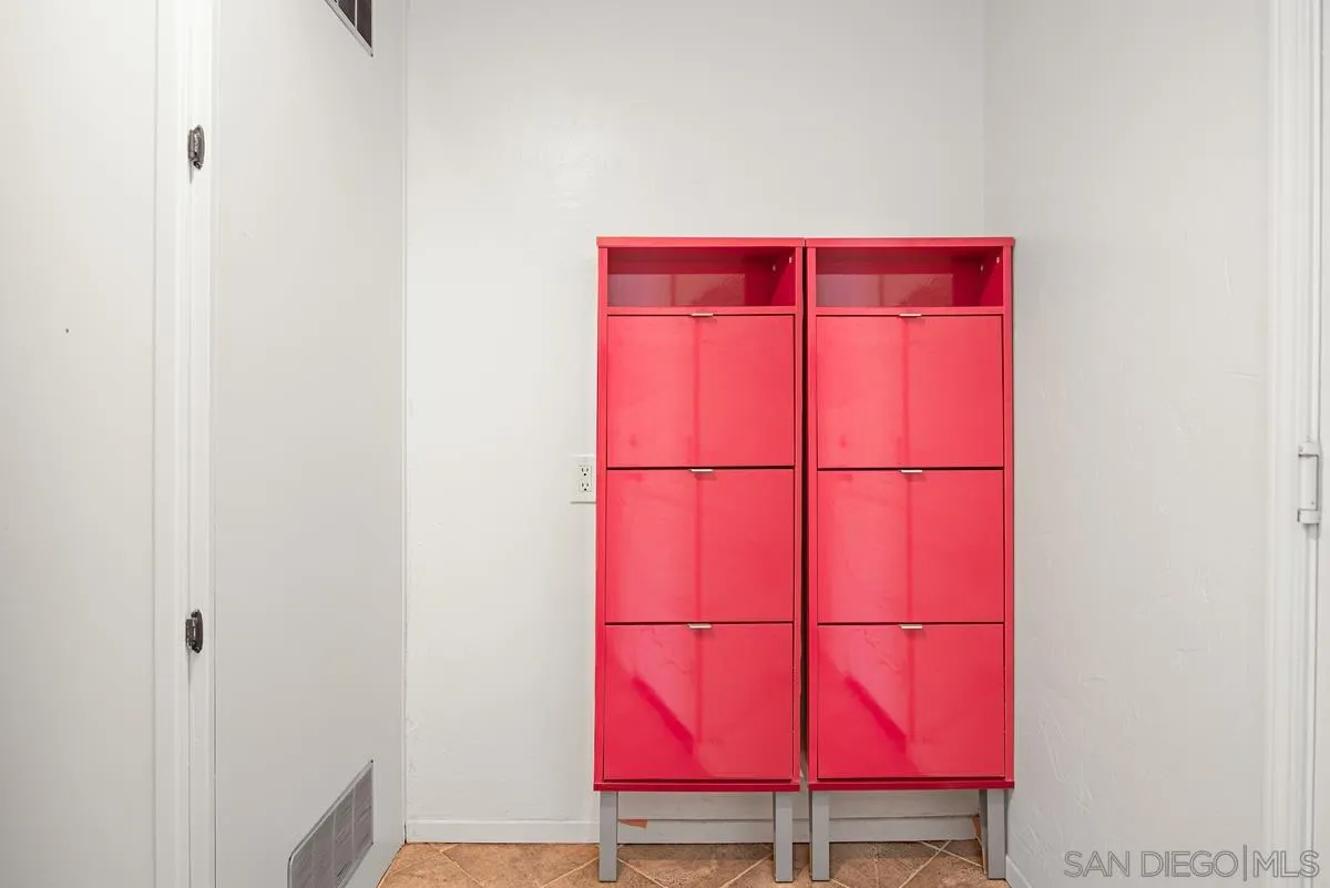 4031 Grayson Drive San Diego, CA 92130 - Photo 22 of 40 a room with red walls and white door