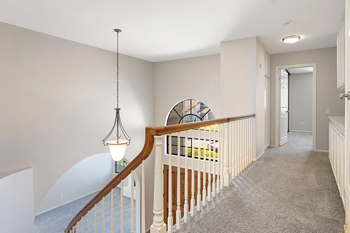 4031 Grayson Drive San Diego, CA 92130 - Photo 23 of 40 a view of a hallway view with staircase