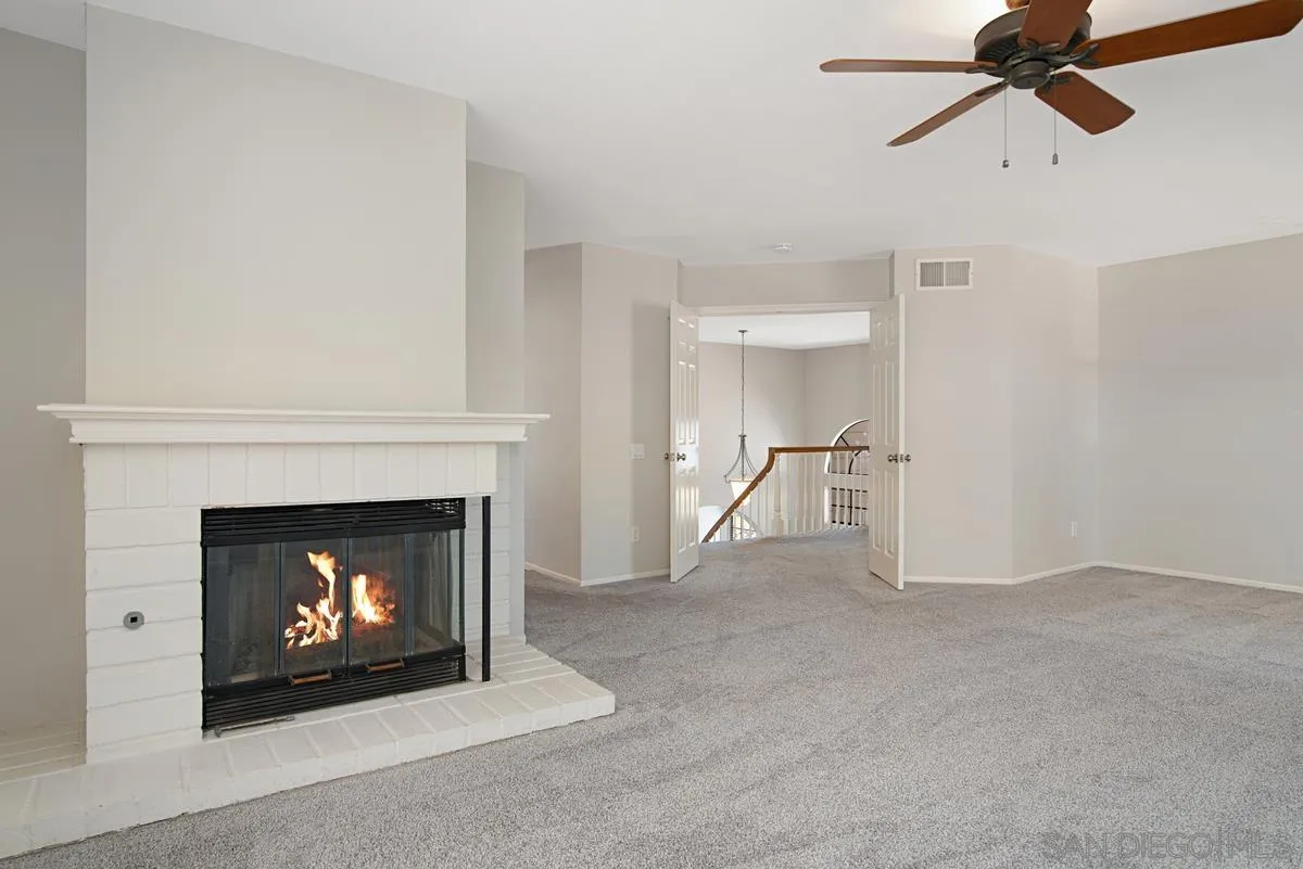 4031 Grayson Drive San Diego, CA 92130 - Photo 25 of 40 a living room with a fireplace