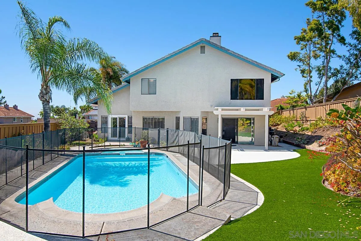 4031 Grayson Drive San Diego, CA 92130 - Photo 38 of 40 a view of a house with swimming pool and sitting area