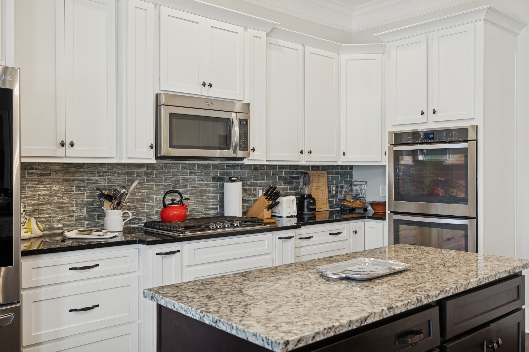 6400 Harding Pike Nashville, TN 37205 - Photo 15 of 38 a kitchen with granite countertop cabinets and steel stainless steel appliances