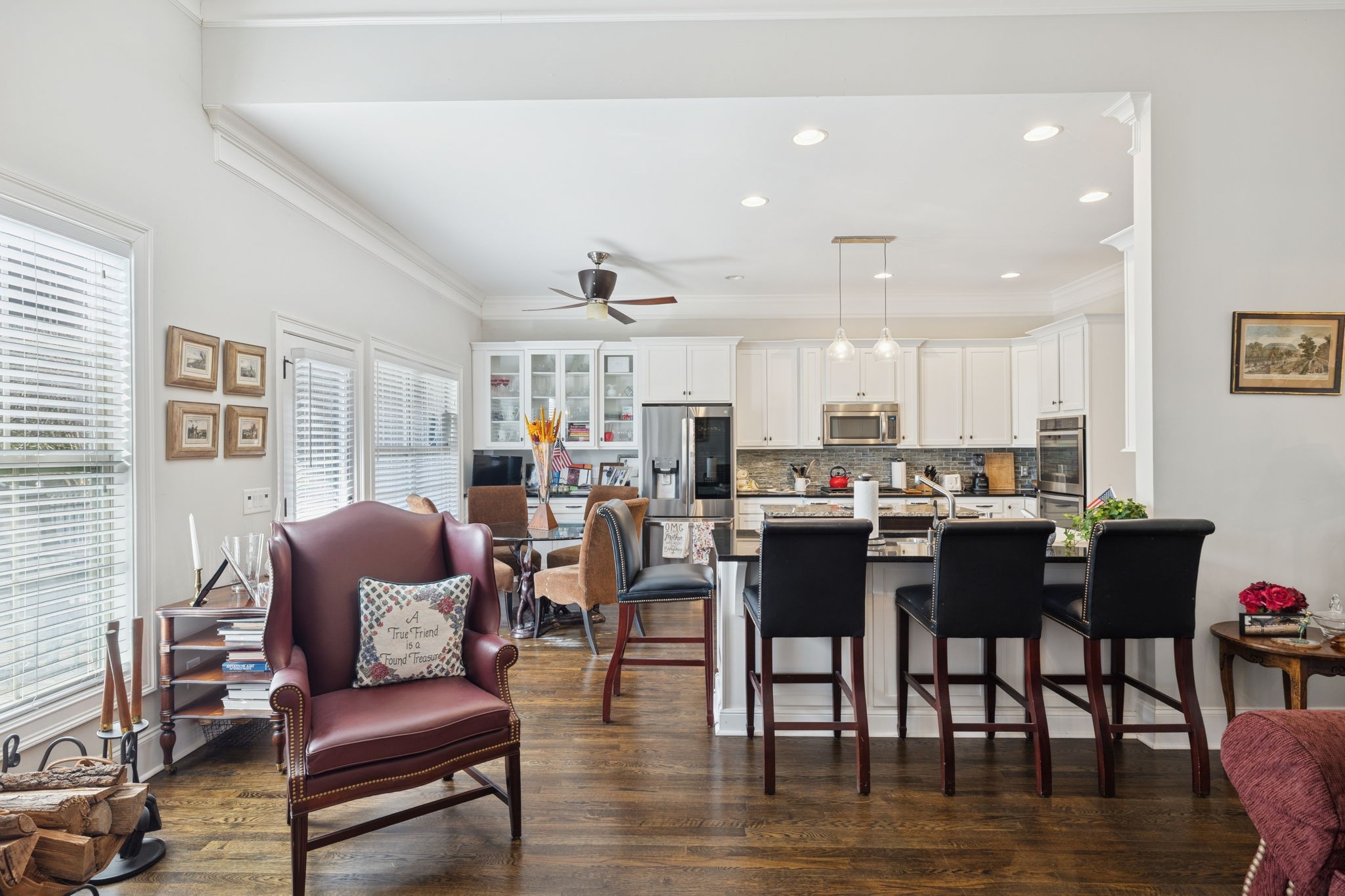 6400 Harding Pike Nashville, TN 37205 - Photo 16 of 38 a living room with furniture kitchen view and a wooden floor