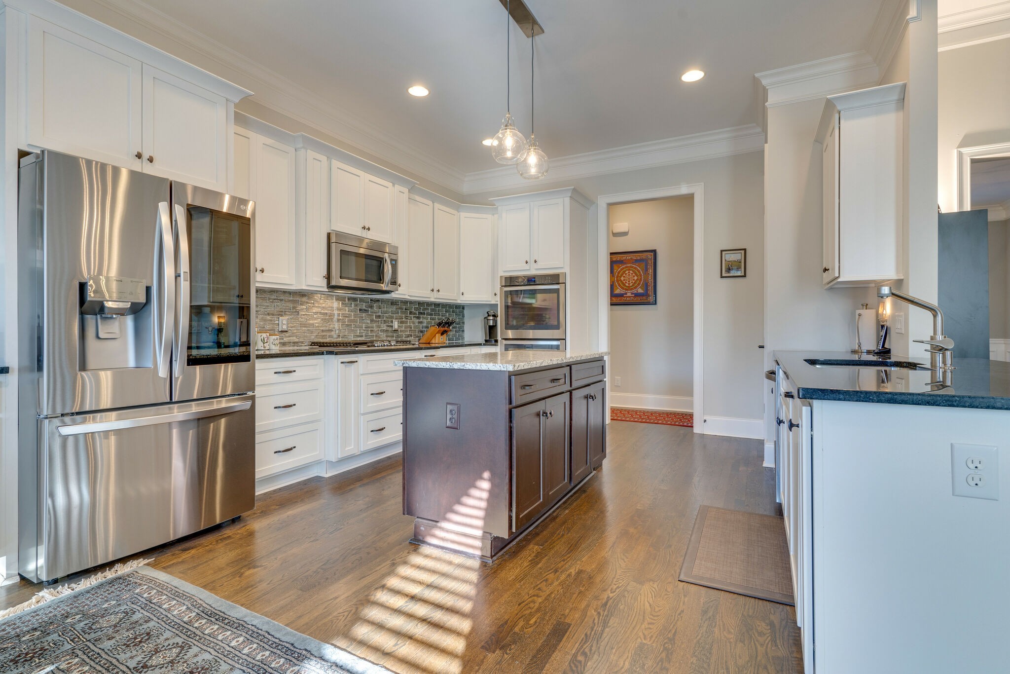 6400 Harding Pike Nashville, TN 37205 - Photo 17 of 38 a kitchen with stainless steel appliances granite countertop a refrigerator a stove and a sink