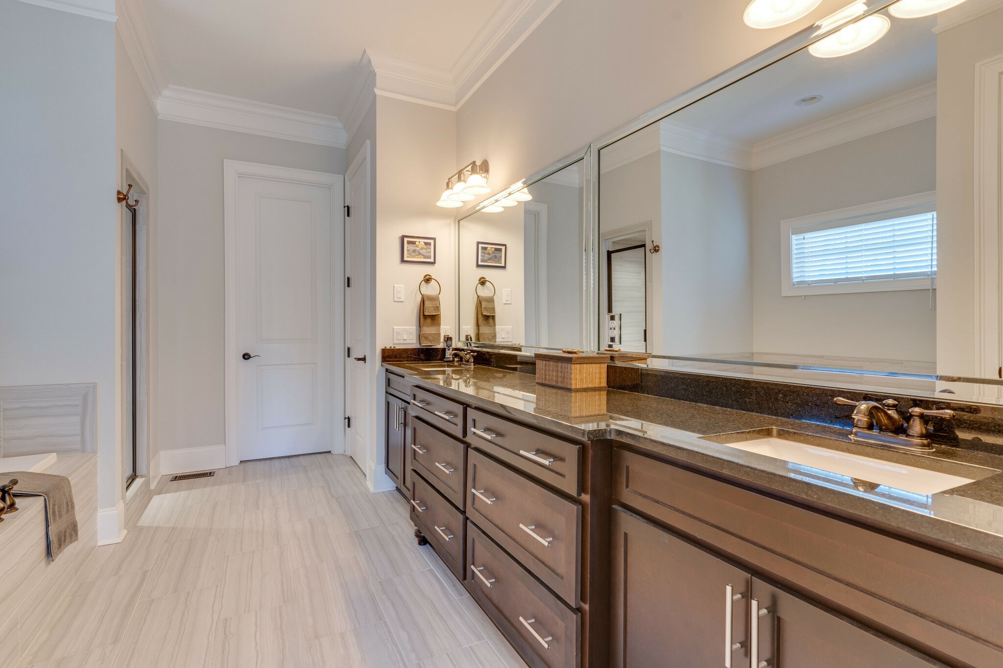 6400 Harding Pike Nashville, TN 37205 - Photo 22 of 38 a spacious bathroom with a double vanity sink and mirror