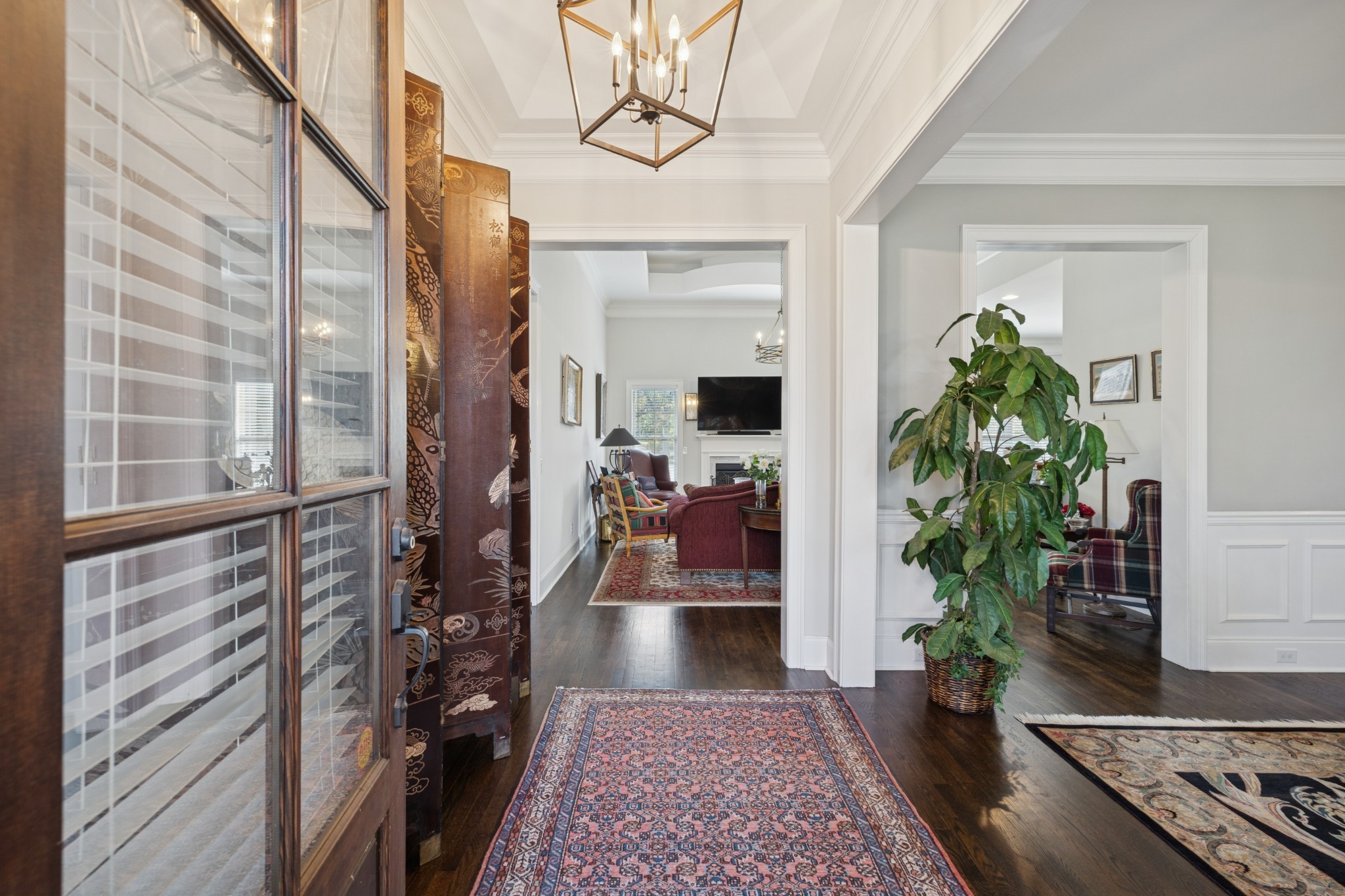 6400 Harding Pike Nashville, TN 37205 - Photo 9 of 38 a view of a hallway with wooden floor and a potted plant