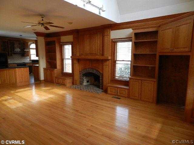 20800 River Road Chesterfield, VA 23838 - Photo 2 of 12 a view of an empty room with a fireplace and a window