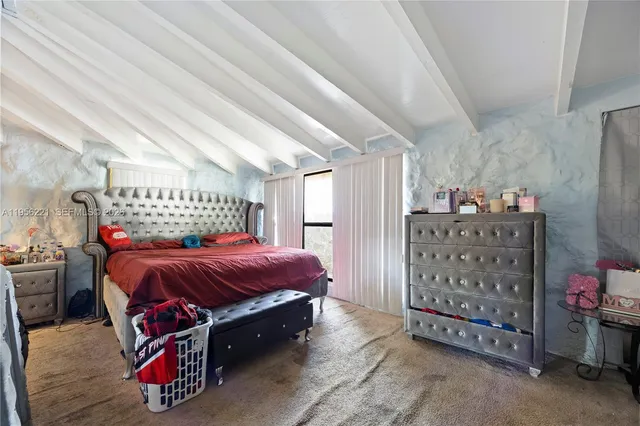 a bed room with a bed and a couch