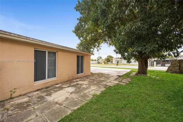 a view of porch with large trees