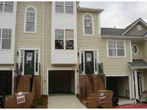 6319 Gammon Road, Unit 1505 Charlotte, NC 28269 - Photo 1 of 1 a front view of a house with many windows
