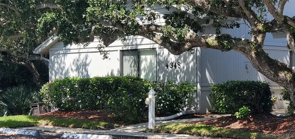 a view of a back yard of the house
