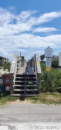 a view of a garden with outdoor seating