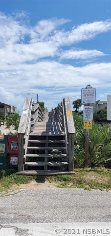 a view of a garden with outdoor seating