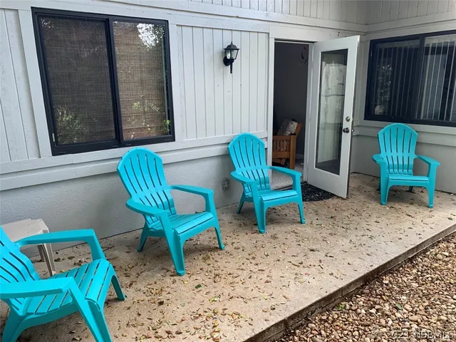 a view of a room with furniture and a rug