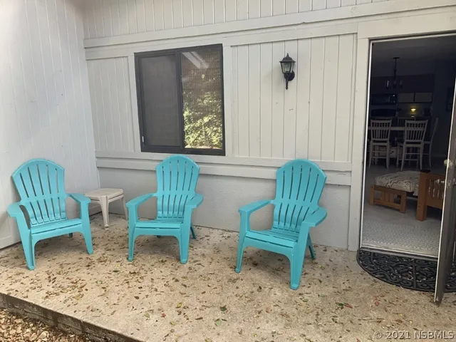 a chair and a rug in a room