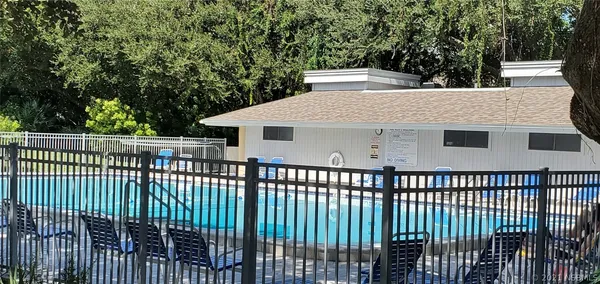 a view of a white house with a balcony