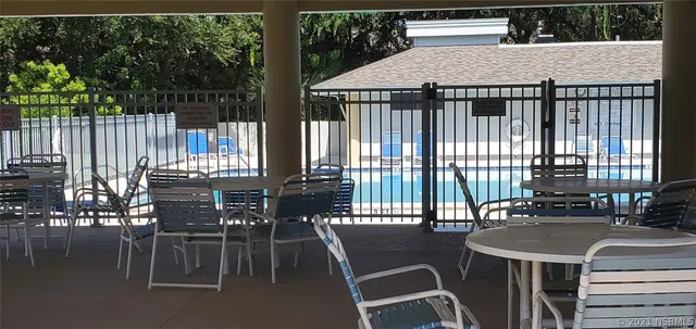 a roof deck with a table and chairs