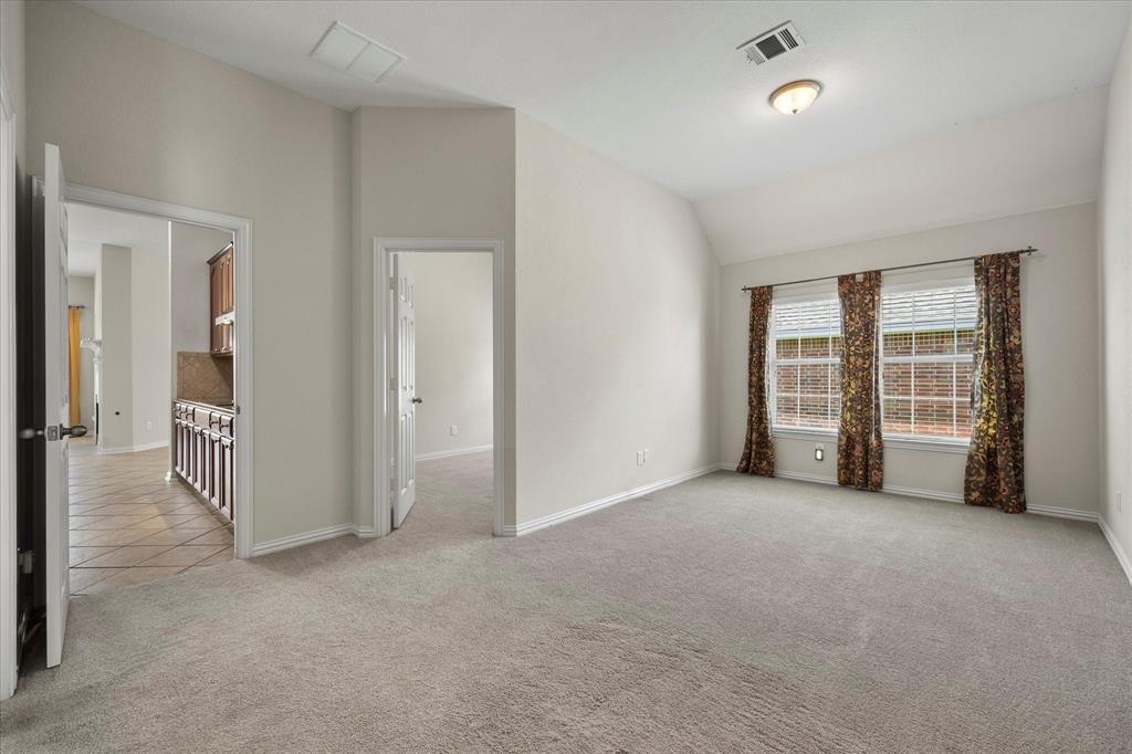 207 Leonard Way Fate, TX 75087 - Photo 19 of 31 an empty room with windows