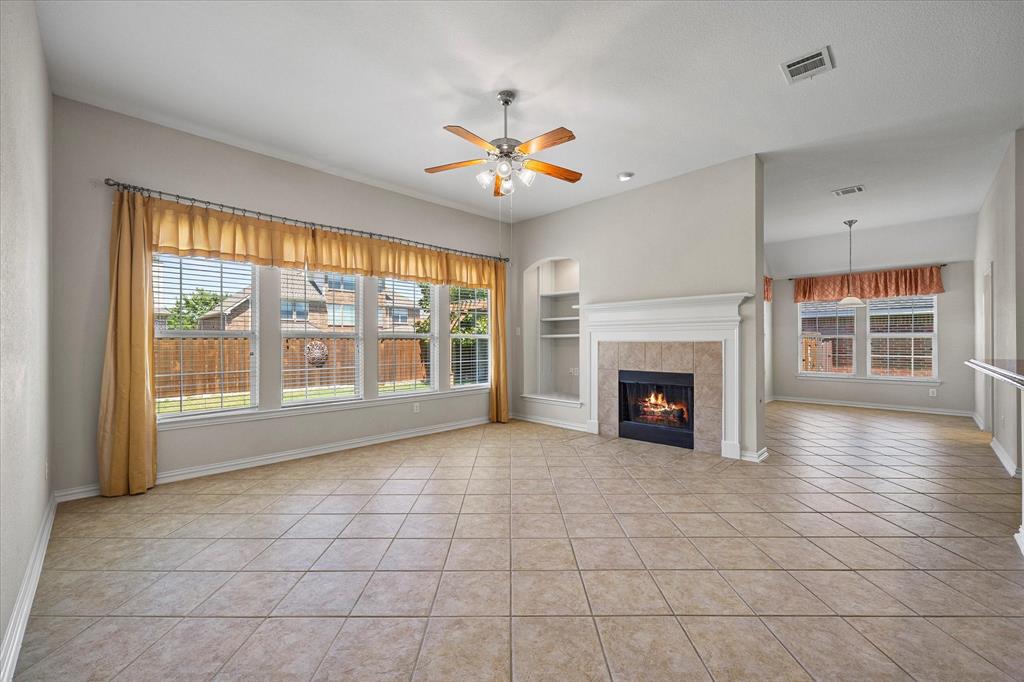 207 Leonard Way Fate, TX 75087 - Photo 2 of 31 a view of an empty room with window and fire place