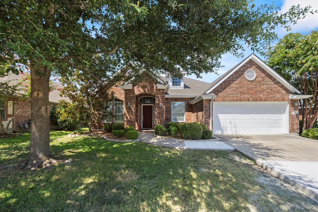 207 Leonard Way Fate, TX 75087 - Photo 28 of 31 a front view of a house with a yard and garage
