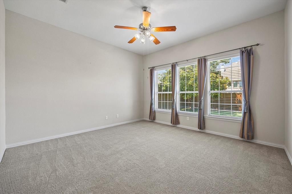 207 Leonard Way Fate, TX 75087 - Photo 4 of 31 a view of an empty room with a window