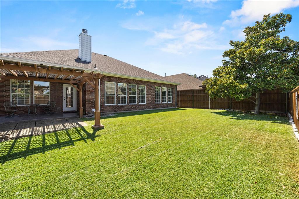 207 Leonard Way Fate, TX 75087 - Photo 8 of 31 a view of a house with a backyard