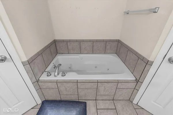 a utility room with washing machine
