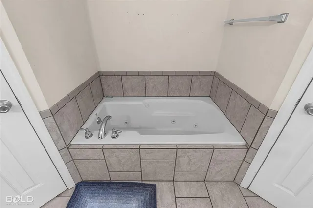 a utility room with washing machine