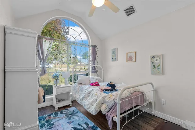 a bed room with a bed and a window